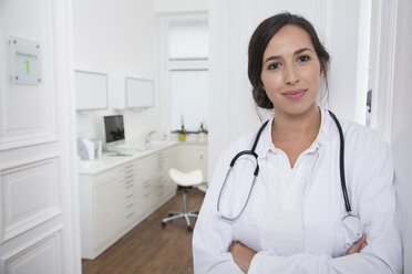 Portrait of smiling doctor at medical practice - FKF001490