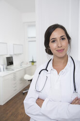 Portrait of smiling doctor at medical practice - FKF001492