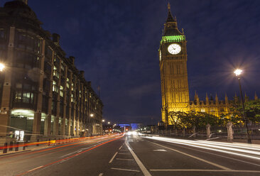 UK, London, light trails on a lane beside Big Ben at night - ZMF000433