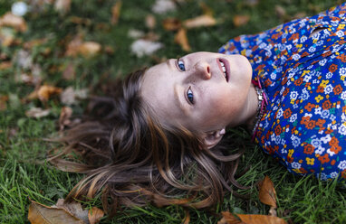 Portrait of girl lying on a meadow - MGOF000944