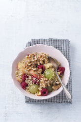 Bowl of quinoa with fruit salad and walnuts - MYF001178