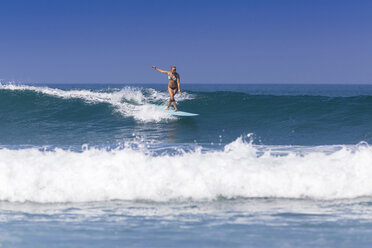 Indonesia, Bali, surfing woman - KNTF000139