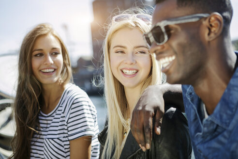 Germany, Duisburg, three young people having fun at Media Harbour - GDF000881