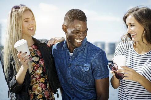 Germany, Duisburg, three young people having fun at Media Harbour - GDF000882