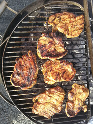 Marinated pork chops on barbecue grill - CSF026566