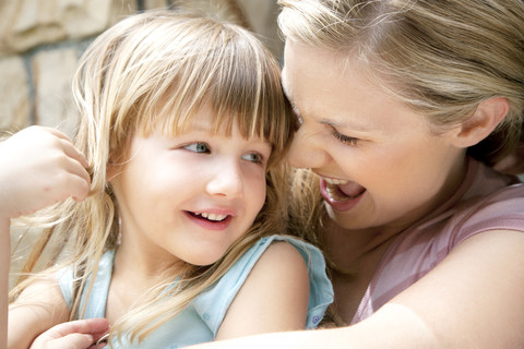 Woman with her little daughter stock photo