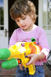 Portrait of little girl with water gun - RMAF000047