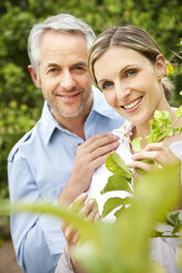 Portrait of smiling couple in the garden - RMAF000128