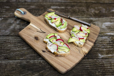 Avocado radish bread on chopping board - SARF002245