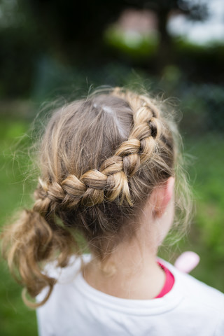Braided hair of a blond girl stock photo