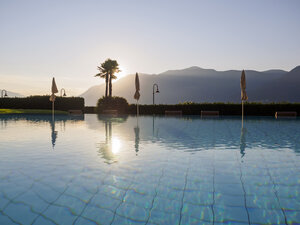 Switzerland, Ticino, Lago Maggiore, swimming pool at lakeside - LAF001534