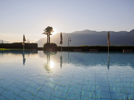 Switzerland, Ticino, Lago Maggiore, swimming pool at lakeside - LAF001534