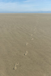 Germany, Eastern Friesland, Lower Saxon Wadden Sea National Park, footprints at low tide - KEBF000272