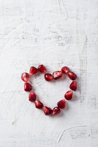 Heart shaped of pomegranate seeds stock photo