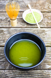 Bowl of matcha tea, matcha powder and tea whisk - SARF002294