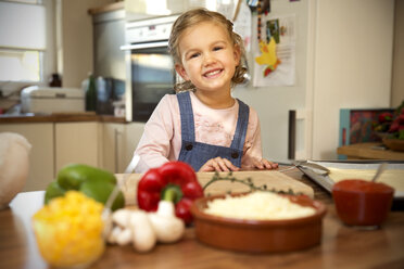 Portrait of smiling girl in kitchen - TOYF001512