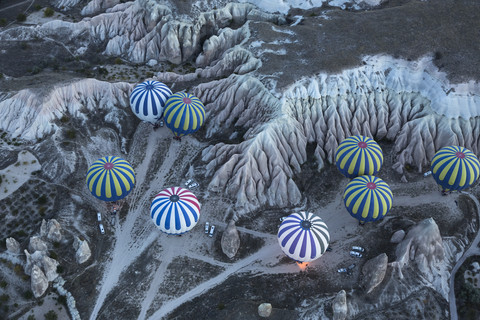 Turkey, Anatolia, Cappadocia, hot air ballons near Goereme over tuff rock landscape stock photo