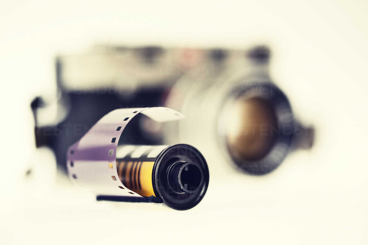Negative film and old camera in the background, close-up stock photo