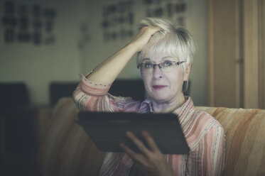 Portrait of senior woman with digital tablet - FRF000362