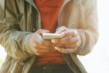 Hands of young man using smartphone - EBSF001041