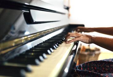 Close-up of woman playing piano - MGOF001050