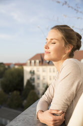 Young woman on balcony, enjoying the view - FKF001603
