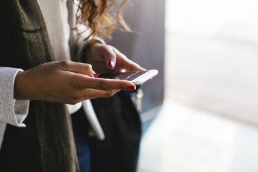 Close-up of woman text messaging - EBSF001118