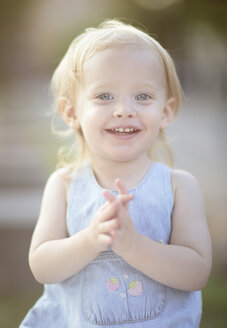 Portrait of smiling blond little girl wearing summer dress - NIF000066