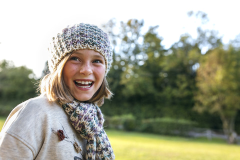 Portrait of laughing girl in a park stock photo