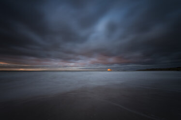 United Kingdom, Scotland, East Lothian, North Berwick, Bass Rock at sunset, stormy weather - SMAF000391