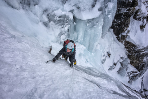 UK, Scotland, Glencoe, Ben Udlaih, woman ice climbing stock photo