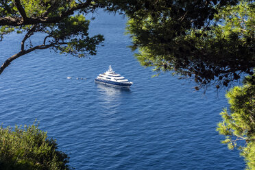 Italy, Capri, luxury yacht anchoring at steep coast - WEF000426