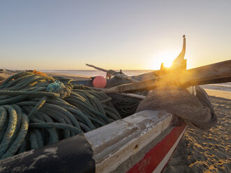 Portugal, Praia de Mira, fishing boat on the beach at backlight - LAF001571