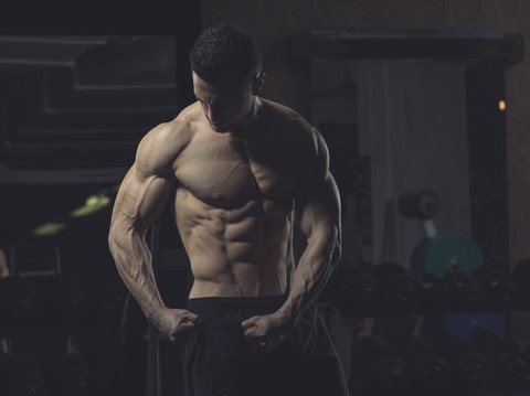 Athlete posing, musles stock photo