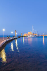 Greece, Rhodes, entrance to Mandraki harbour at blue hour - WDF003385