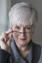 Portrait of smiling senior woman with spectacles - FRF000365