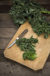 Organic kale on chopping board - LVF004186