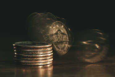 Coins falling from stack of coins - EBSF001153