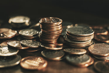 Heap and stacks of coins stock photo