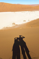 Namibia, Namib Desert, shadow of couple looking to Deadvlei - GEMF000508