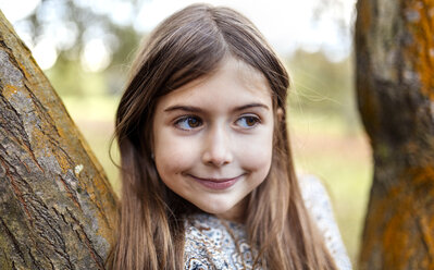 Portrait of smiling girl in nature - MGOF001116