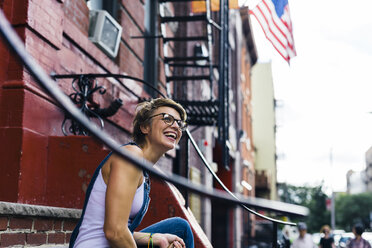 USA, New York City, Williamsburg, portrait of happy blond woman - GIOF000572