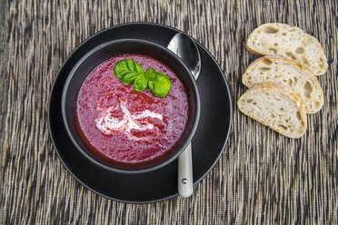 Bowl of beetroot soup, white bread - SARF002374