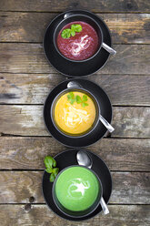 Pea soup, beetroot and pumpkin soup in bowls - SARF002377