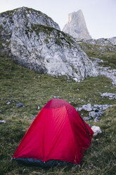 Spain, Picos de Europa, tent with Picu Urriellu mountain in background - ABZF000158