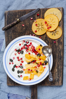Dish of natural yoghurt, kaki, pomegranate seed, almond and pumpkin seed - SBDF002501