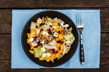 Autumnal salad with kaki, feta cheese, iceberg lettuce, pumpkin seeds, pomegranate and walnuts - SARF002391