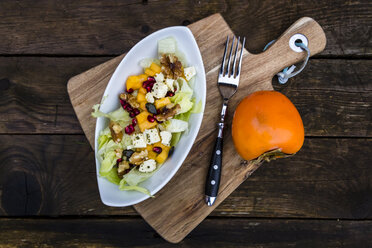 Autumnal salad with kaki, feta cheese, iceberg lettuce, pumpkin seeds, pomegranate and walnuts - SARF002392