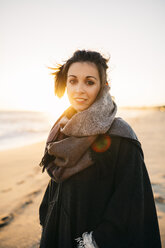 Portrait of young woman on the beach in winter - JRFF000238