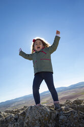 Spain, Consuegra, happy little girl on a mountain - ERLF000093